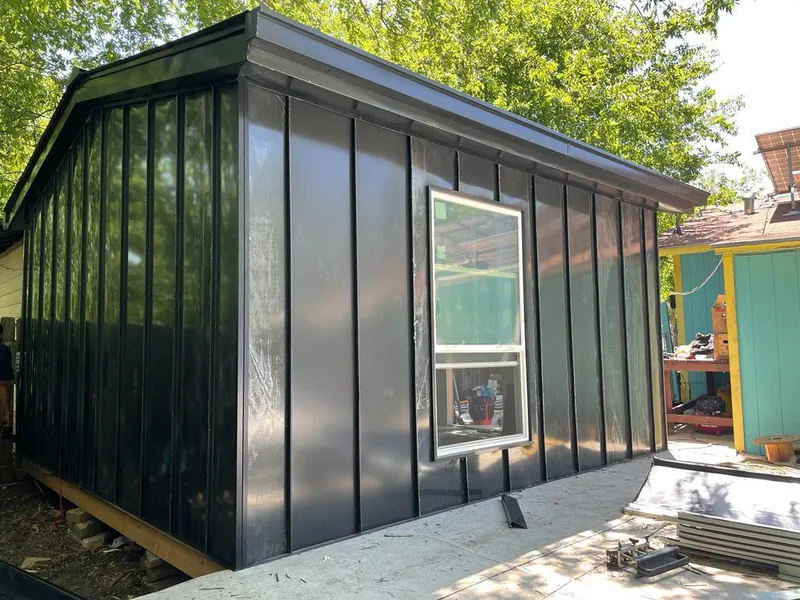 Black standing seam metal wall panels for Roof Inspection in North Fond du Lac