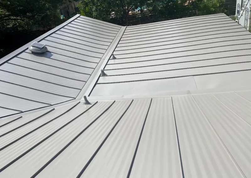 Solar attic fan installed on a metal roof for Roof Ventilation in North Fond du Lac